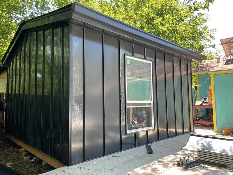 Black standing seam metal wall panels for Roof Inspection in Camano