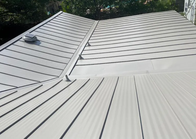 Solar attic fan installed on a metal roof for Roof Ventilation in Camano
